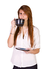 Image showing Woman Drinking Coffee Standing Up