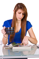 Image showing Beautiful Woman Reading a Magazine