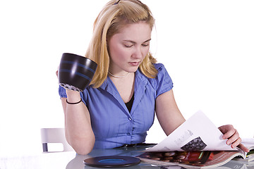 Image showing Beautiful Woman Reading a Magazine