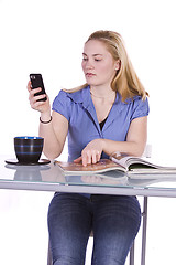 Image showing Beautiful Woman Reading a Magazine