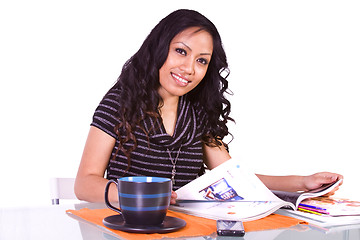 Image showing Beautiful Woman Reading a Magazine