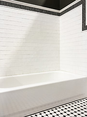 Image showing New modern bathroom with white tile walls