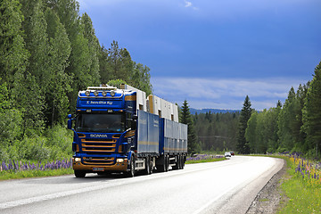 Image showing Truck Transport Under Dark Sky