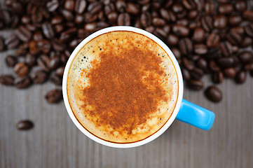 Image showing fresh espresso cup with cinnamon, view from above