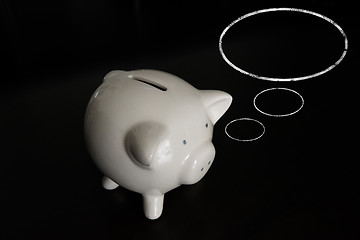 Image showing Piggy bank with thought bubbles and room for your text