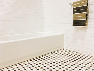 Image showing New bathroom with black and white ceramic tile decor