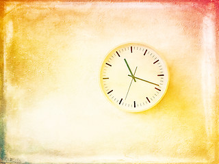 Image showing Modern round clock on bright painted wall