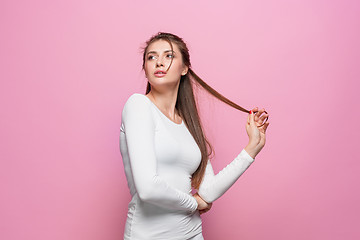 Image showing The young woman\'s portrait with thoughtful emotions