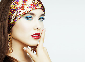 Image showing young pretty modern girl with bright shawl on head emotional posing isolated on white background, lifestyle people concept copyspace