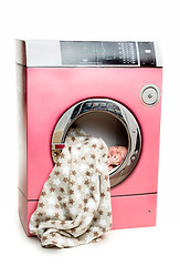 Image showing Portrait of an newborn in a washing machine