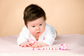 Image showing Bright blue eyed 6 month old baby girl