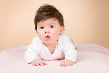 Image showing Bright blue eyed 6 month old baby girl