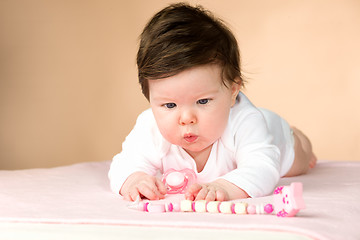 Image showing Bright blue eyed 6 month old baby girl