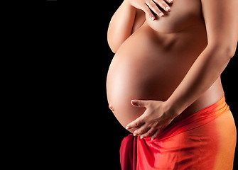 Image showing Beautyful Naked Pregnant woman caressing her belly