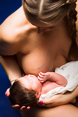 Image showing mother breast feeding her child