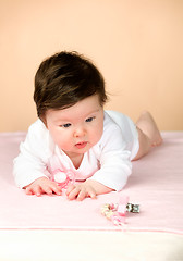 Image showing Bright blue eyed 6 month old baby girl