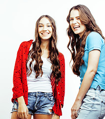 Image showing best friends teenage girls together having fun, posing emotional on white background, besties happy smiling, lifestyle people concept close up