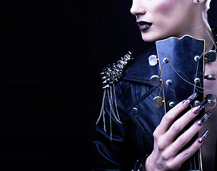 Image showing Fashion Rocker Style Model Girl Portrait. Hairstyle. Punk Woman Makeup, Hairdo and black Nails. Smoky Eyes