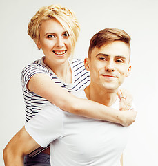 Image showing young pretty teenage couple, hipster guy with his girlfriend happy smiling and hugging isolated on white background, lifestyle people concept 