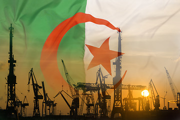 Image showing Industrial concept with Algeria flag at sunset