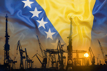 Image showing Industrial concept with Bosnia and Herzegovina flag at sunset