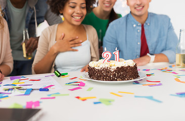 Image showing team greeting coworker at office birthday party