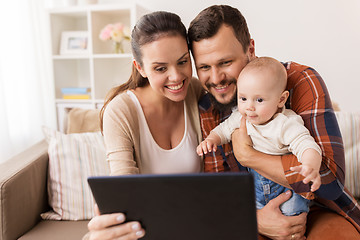 Image showing mother, father and baby with tablet pc at home