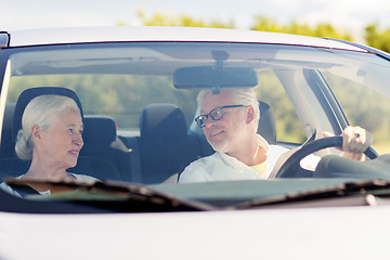 Image showing happy senior couple driving in car