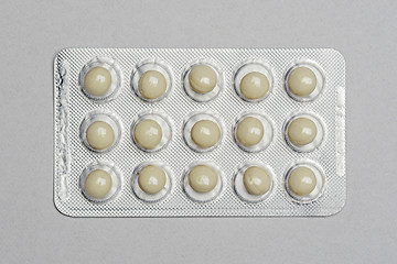 Image showing Pills in a pack on gray paper background