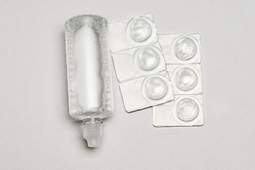 Image showing Contact lens solution and contact lens packages on white background