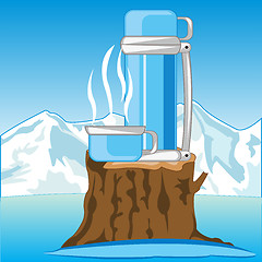 Image showing Thermos with hot tea on nature in winter