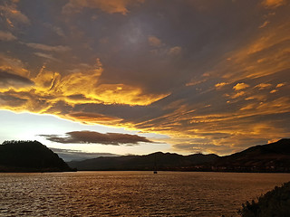 Image showing Sunset clouds over the lake