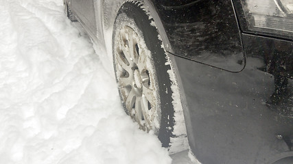 Image showing Winter tires on snowy road