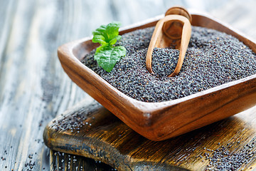 Image showing Poppy seeds in a wooden bowl.