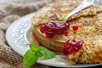 Image showing Delicious pancakes with berry jam.
