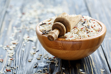 Image showing Scoop into a bowl with mixture of four types of rice closeup.