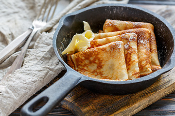 Image showing Crepes with butter and powdered sugar.