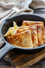 Image showing Crepes with butter for breakfast.