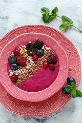 Image showing Red smoothie bowl with beets, blackberries and brown flax.