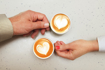 Image showing lovers with cups of coffee