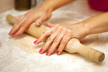 Image showing hands with rolling pin