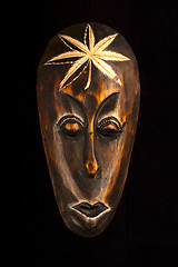 Image showing African wooden mask on black