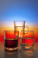 Image showing Glasses with drinks on beautiful gradient background