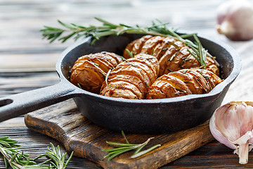 Image showing Potatoes baked with garlic and rosemary.