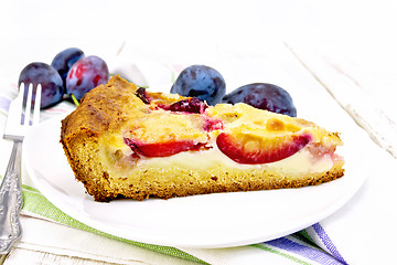 Image showing Pie plum with sour cream in plate on napkin