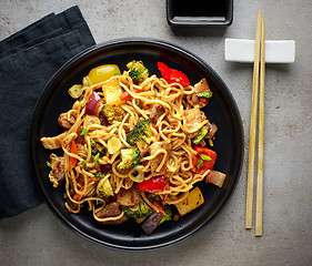 Image showing Plate of noodles with meat and vegetables