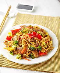 Image showing Plate of noodles with meat and vegetables