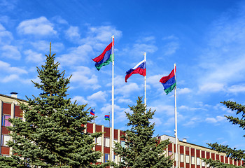 Image showing State flag of Russia is flying in blue sky