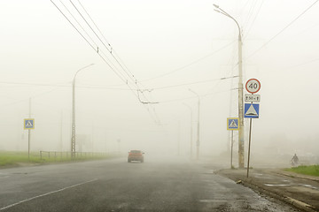 Image showing Dense fog in summer in city on the highway