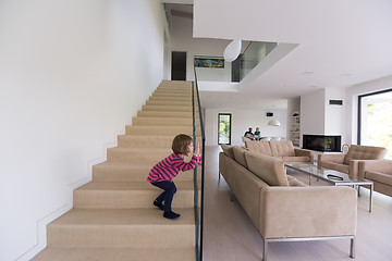 Image showing family with little girl enjoys in the modern living room